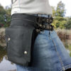 Heuptas met een asymmetrische klep, 2 taille riemen en D-ringen
